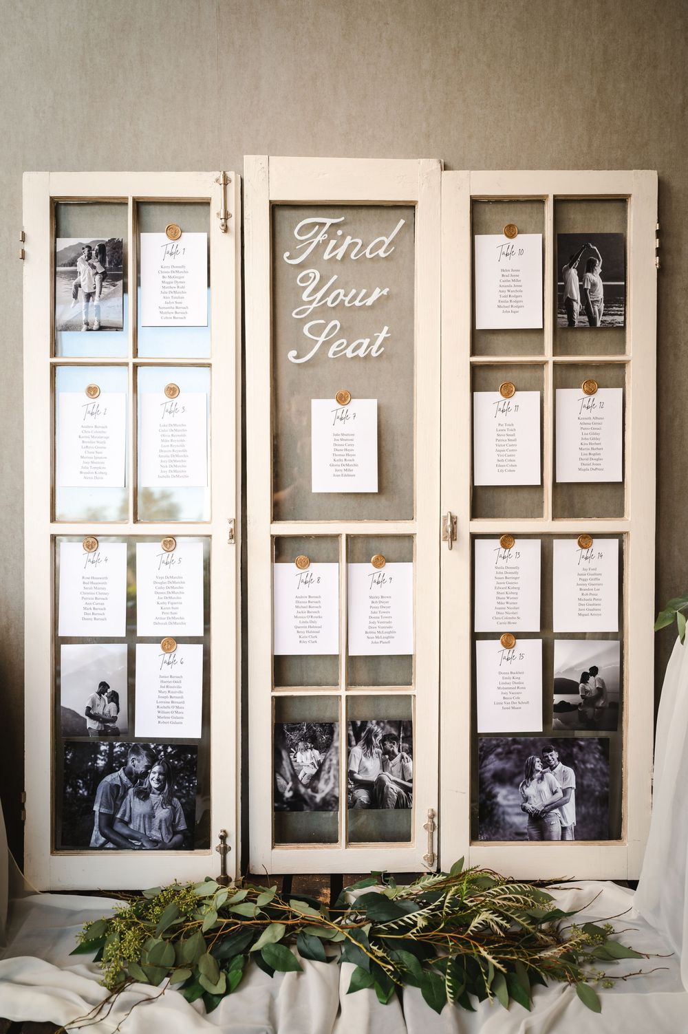 Vintage window frames display a wedding seating chart for rustic Hudson Valley wedding at The Barn at Villa Venezia Middletown, NY.