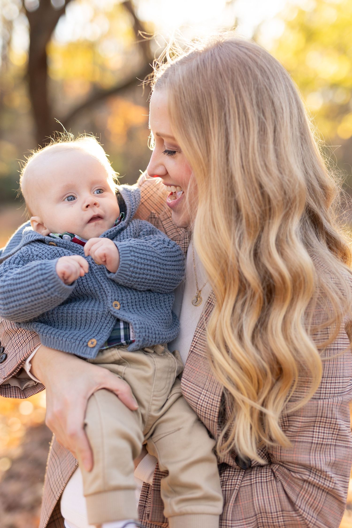 Mother and infant son smiling