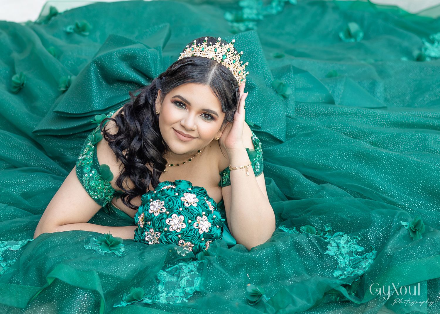 A person wearing an ornate crown and sparkling emerald green ballgown poses gracefully in a glamour photo collage.