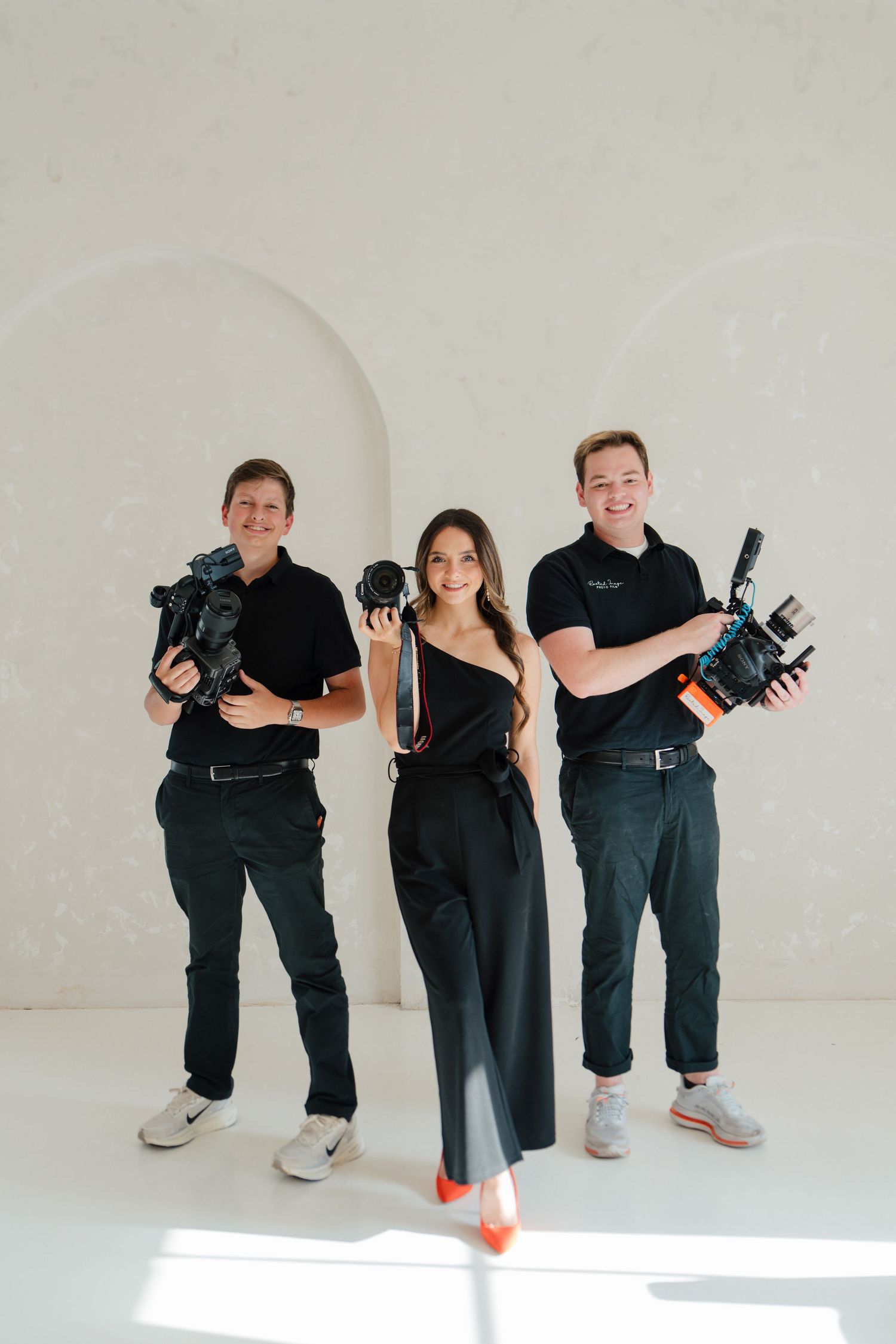 Marketing Agency Team Holding Professional Photography and Videography Gear, ready to service your business.