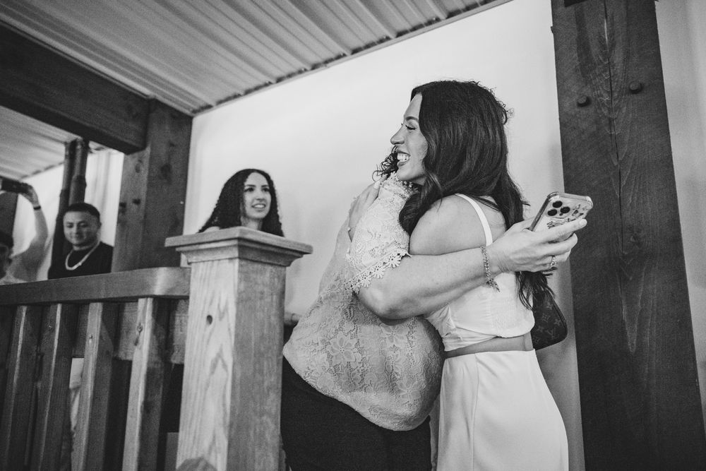 A series of black and white candid photos showing a surprise proposal moment indoors.