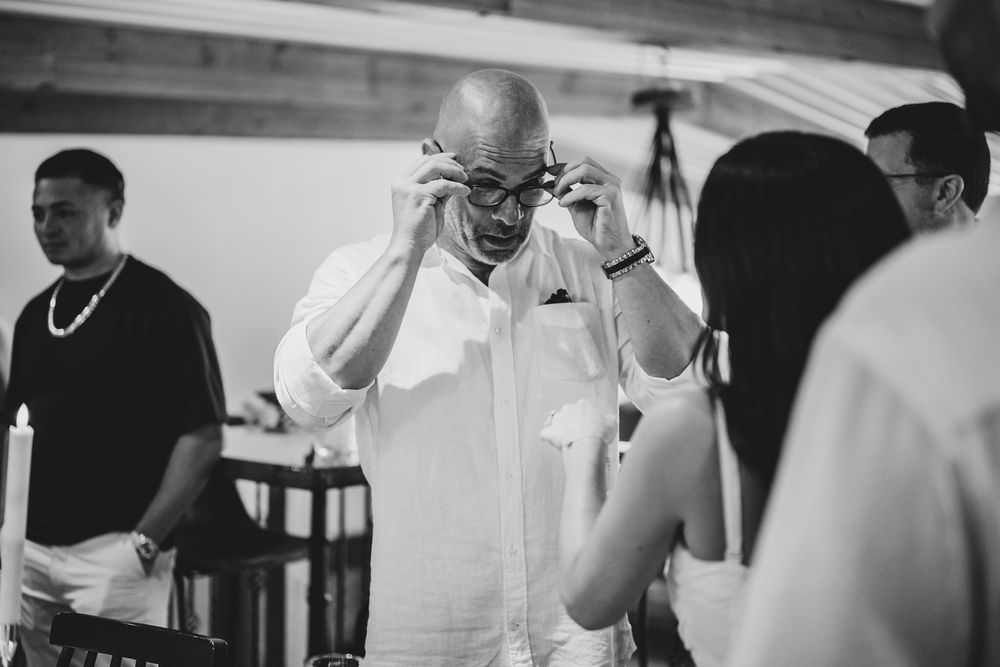Black and white photos capturing emotional reactions during a surprise proposal.