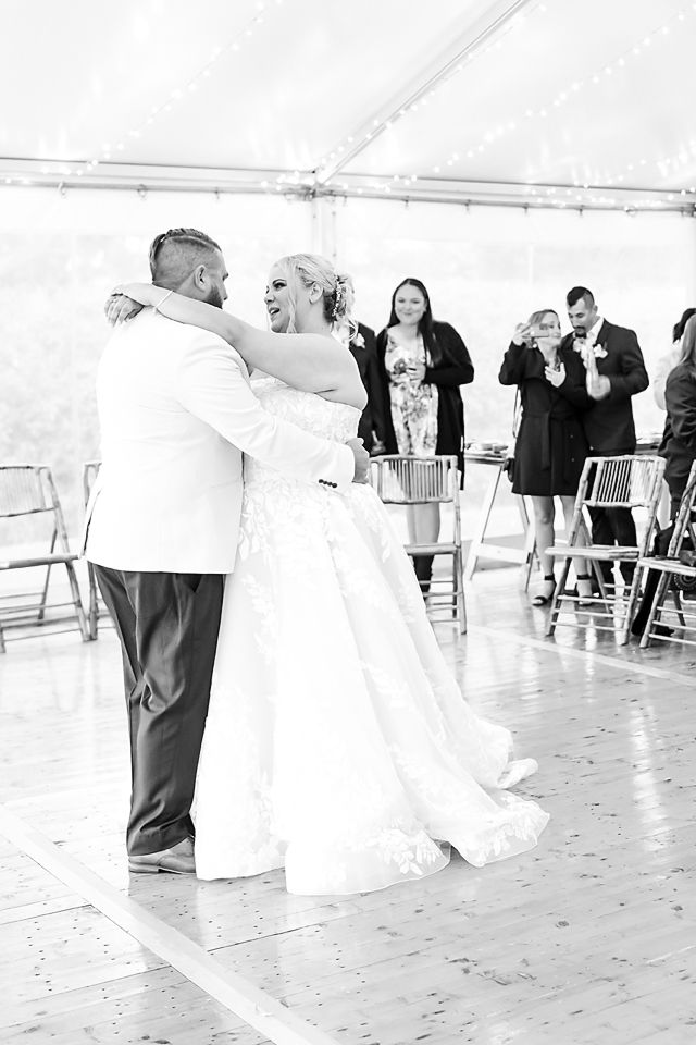 A sequence of black and white photos showing a bride and dancing guests at a wedding reception on a wooden dance floor.