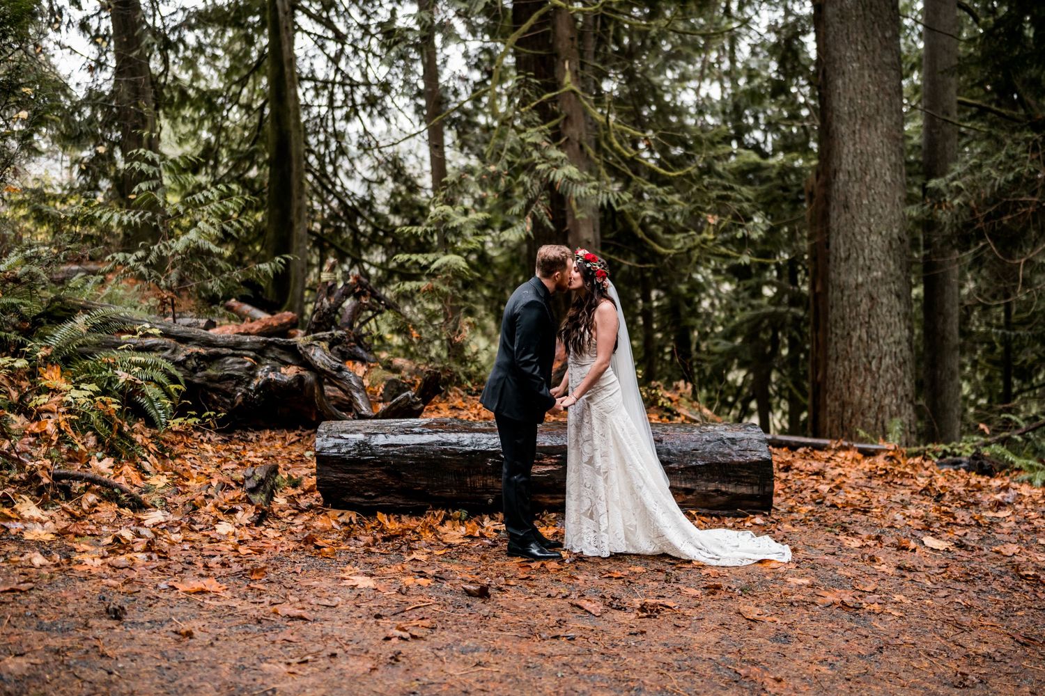 elopement photography of couple sharing a kiss after they eloped in the wilderness near Snoqualmie Falls WA
