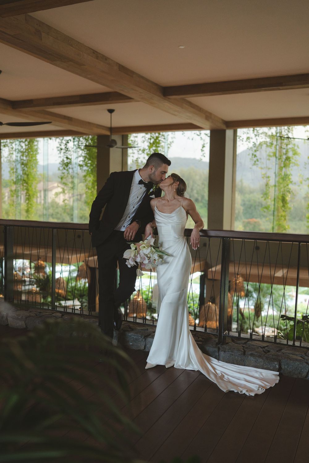 Bride and groom kissing at 1 Hotel Hanalei Bay