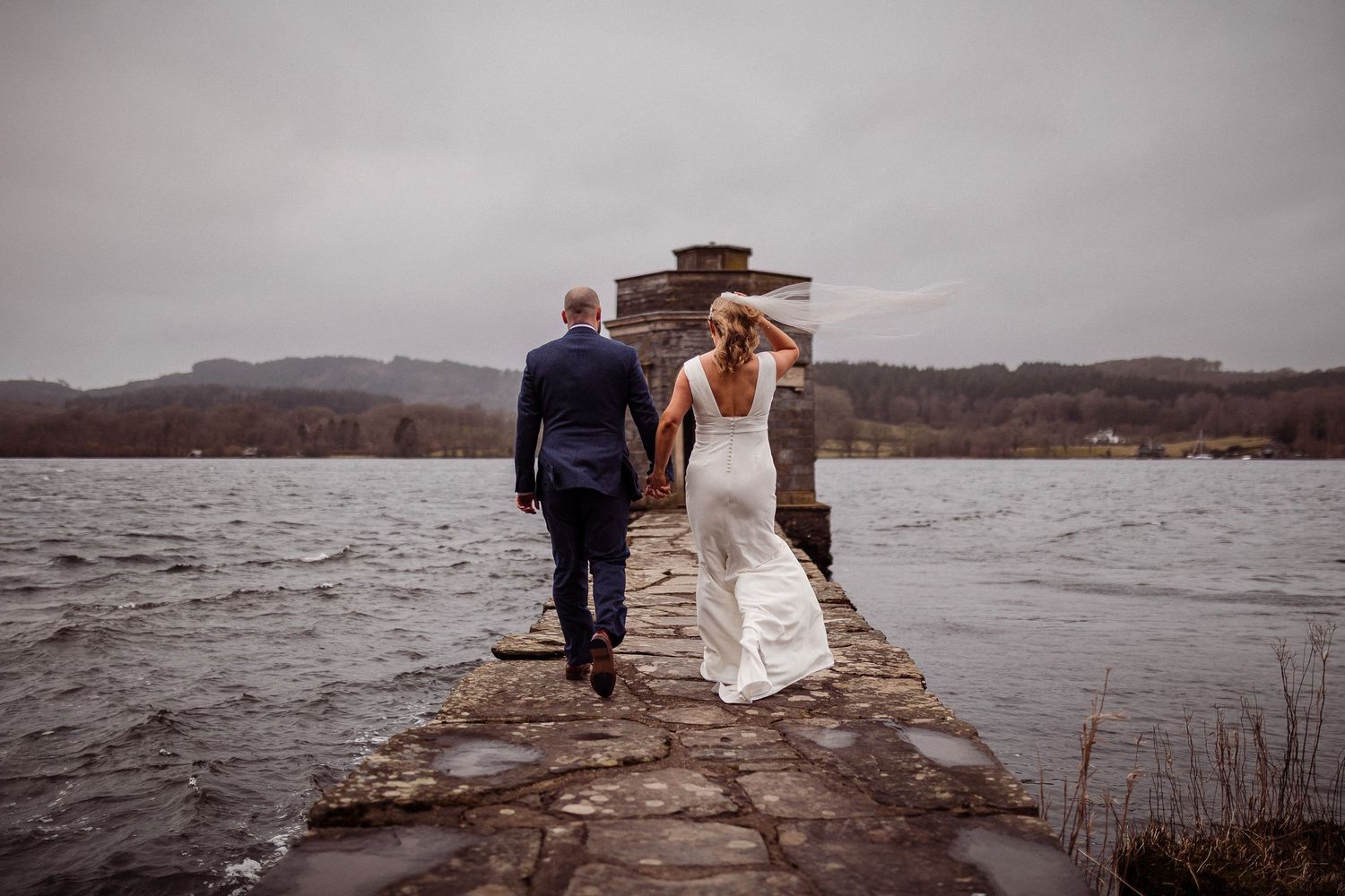 Couple portrait on the jetty at Storrs Hall on Lake Windermere