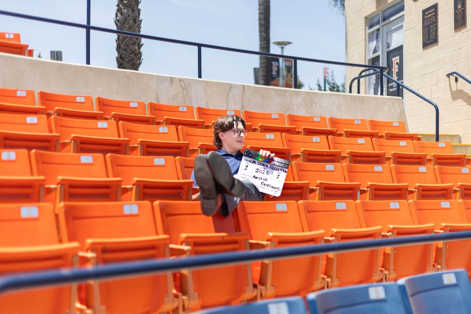 Graduation photo shoot that went to the baseball field stands. Natural light used for the photography session.