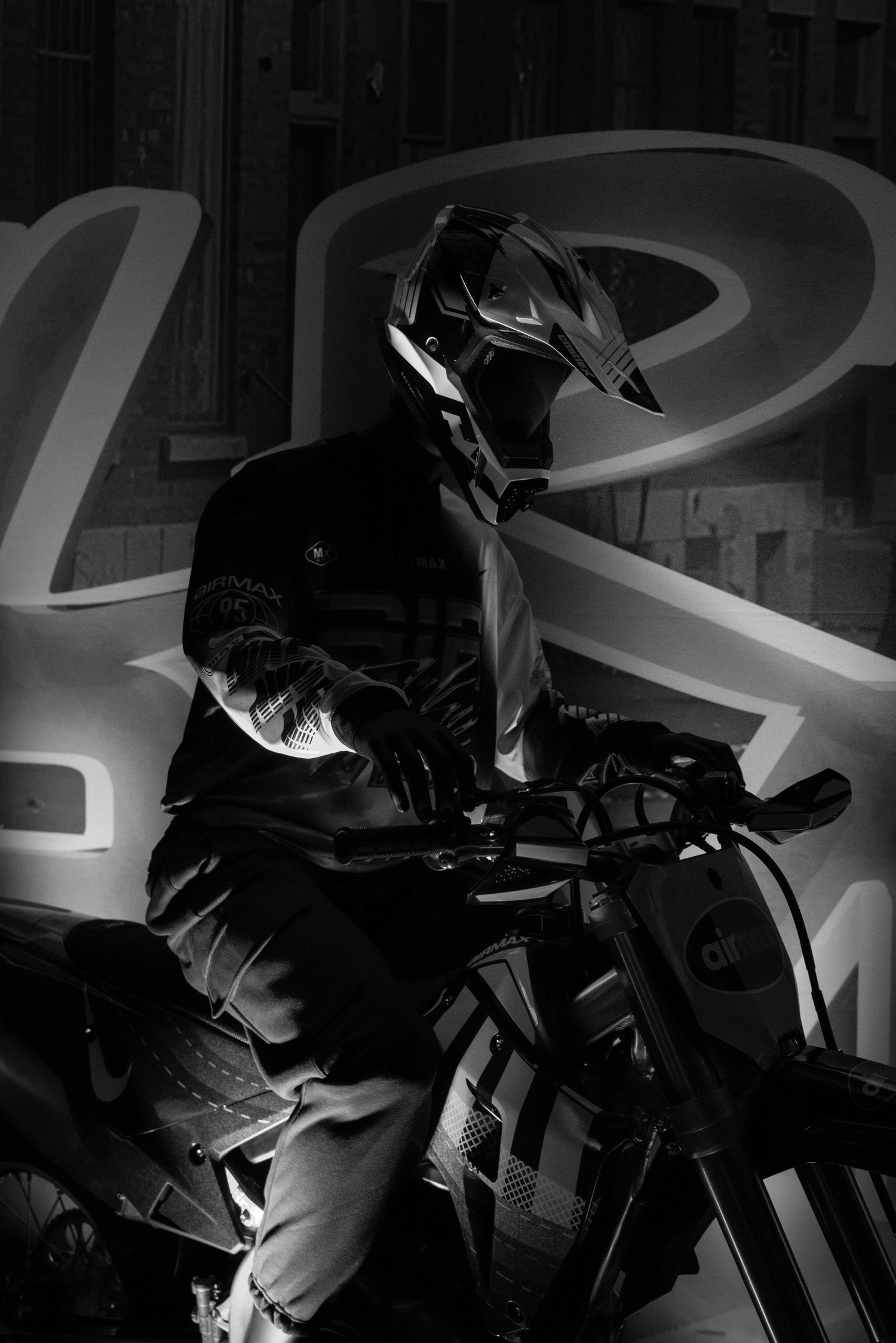 A dark and moody sequence of motorcycle silhouettes against a shadowy background with dramatic lighting effects.