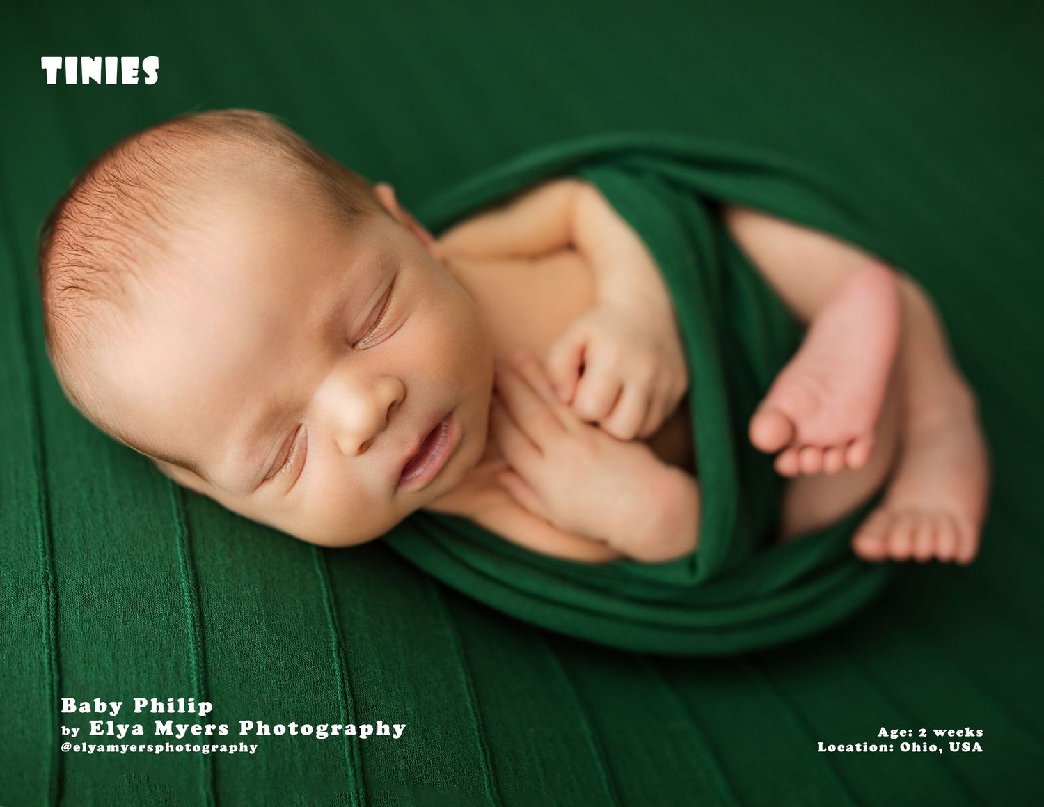 Newborn baby Philip sleeping peacefully wrapped in green fabric, photographed by Elya Myers Photography in Ohio, USA.