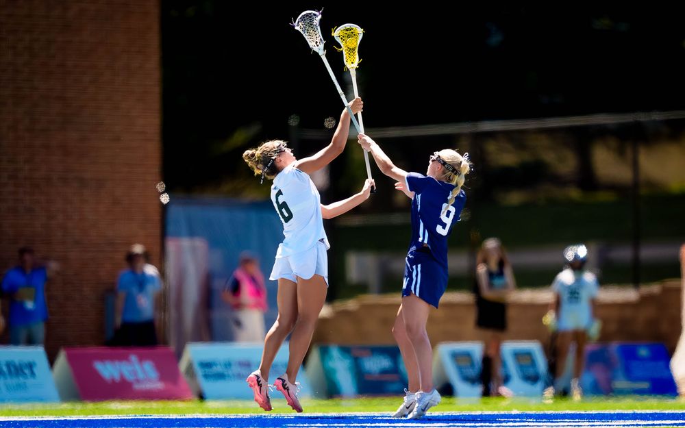 Twin Valley and Wyomissing leap for the draw in PIAA 2A girls lacrosse, by Deanna Fox, SportsFox Photography based in Hershey PA
