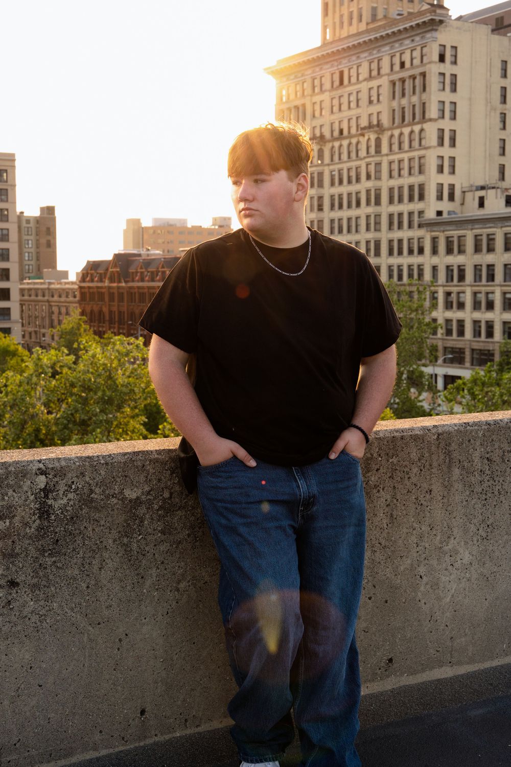 Urban rooftop portrait at sunset with city buildings in background.  - Dayton, Ohio