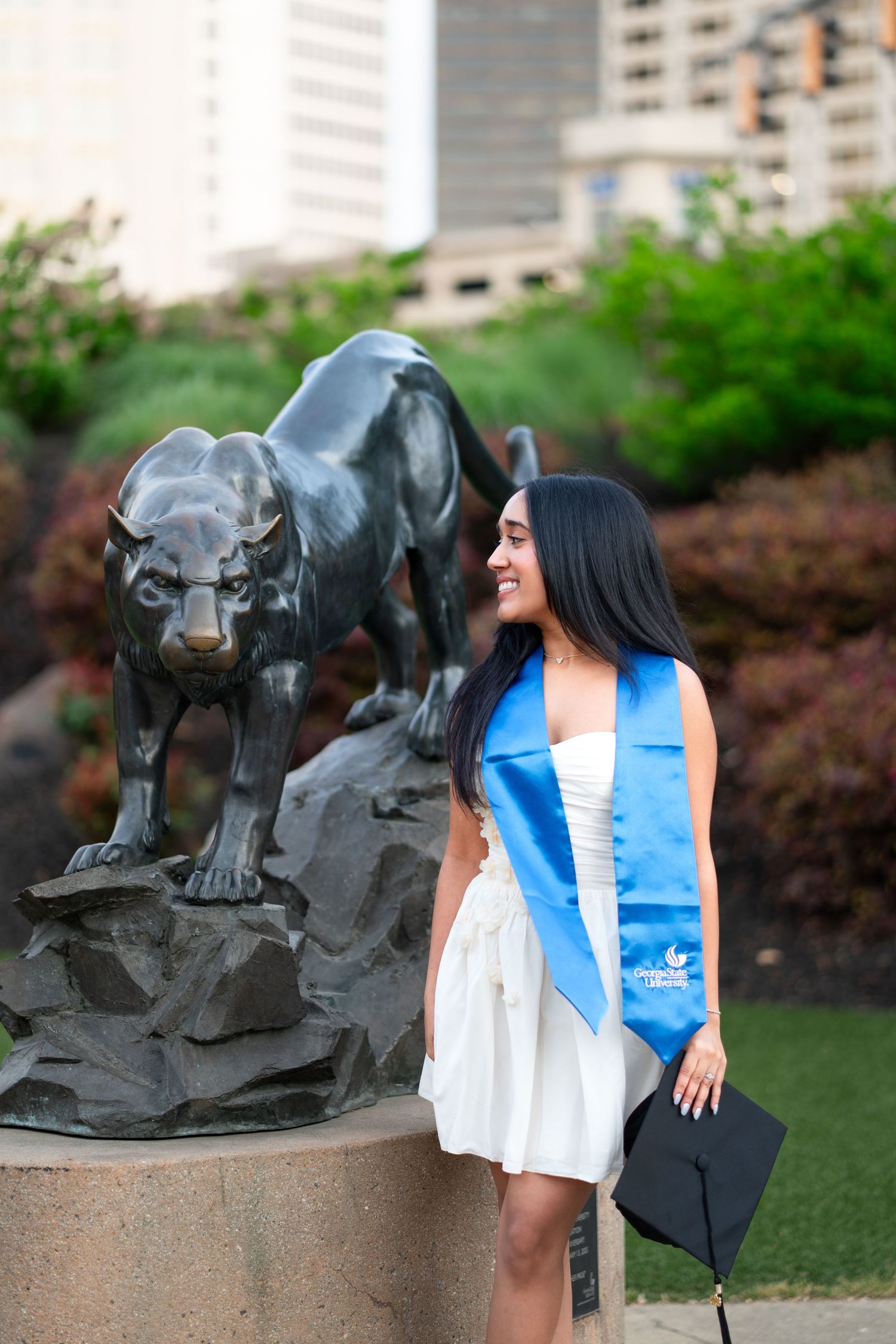 Georgia State graduation photos in front of the iconic student center panther sculpture Atlanta photographer