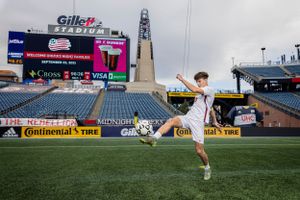 High school senior boy soccer player on the field at Gillette Stadium in Foxboro, Massachusetts