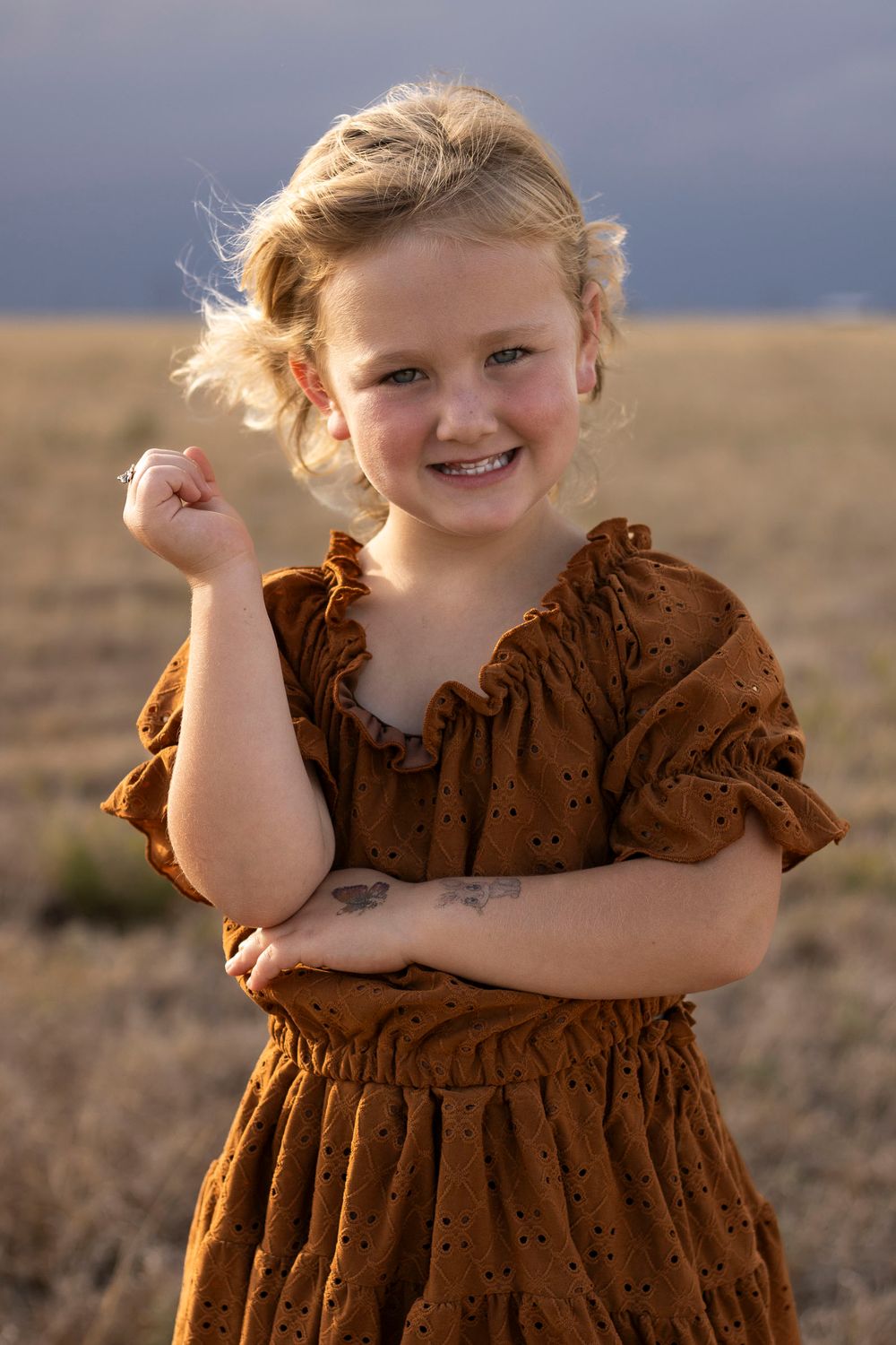 A young girl during a family photo session at an open field in Amarillo, Texas