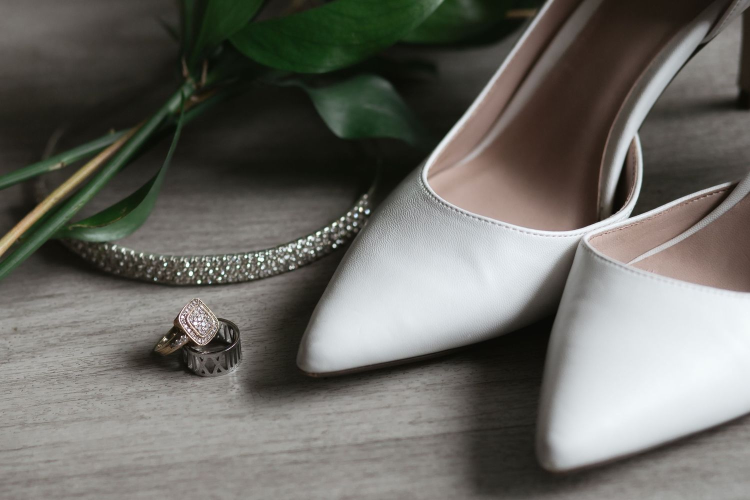 Flat lay details of wedding shoes, rings, diadem and bouquet in Miami