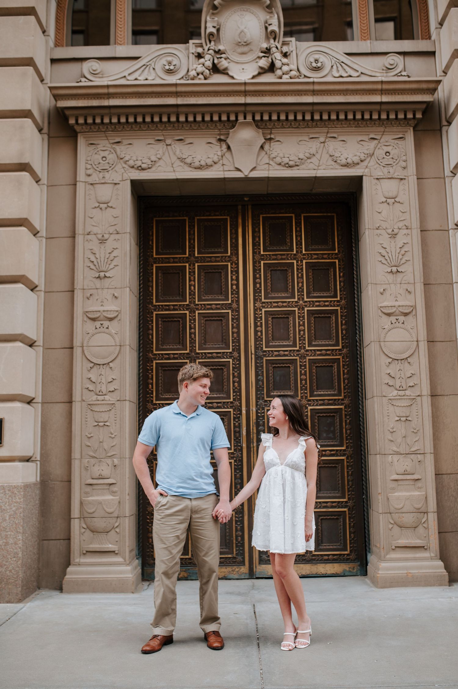 Downtown Wichita, KS engagement session by photographer Jessica Nadine Photography.  Classic architecture buildings city vibe national bank