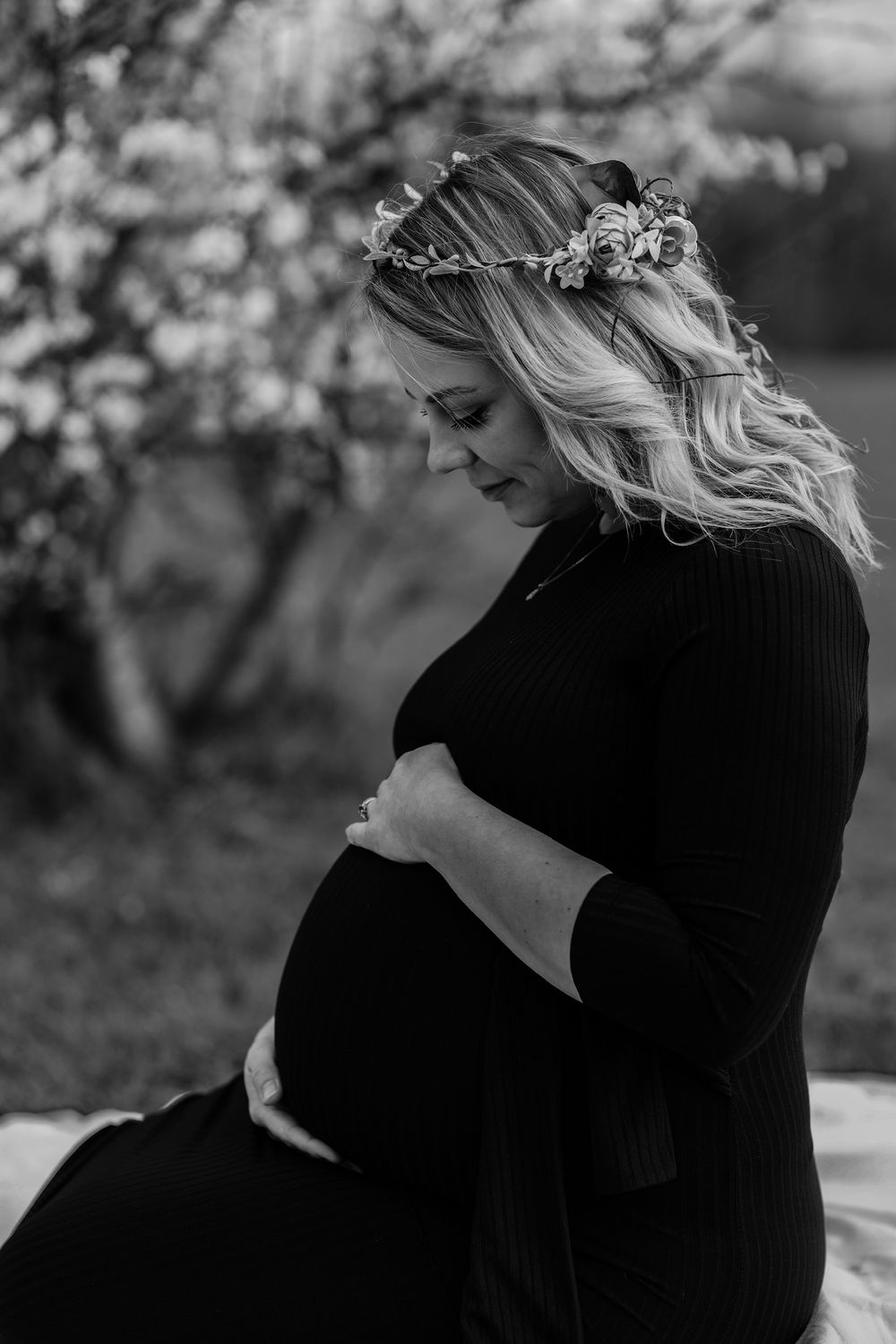 a women holds her baby bump for a maternity photoshoot