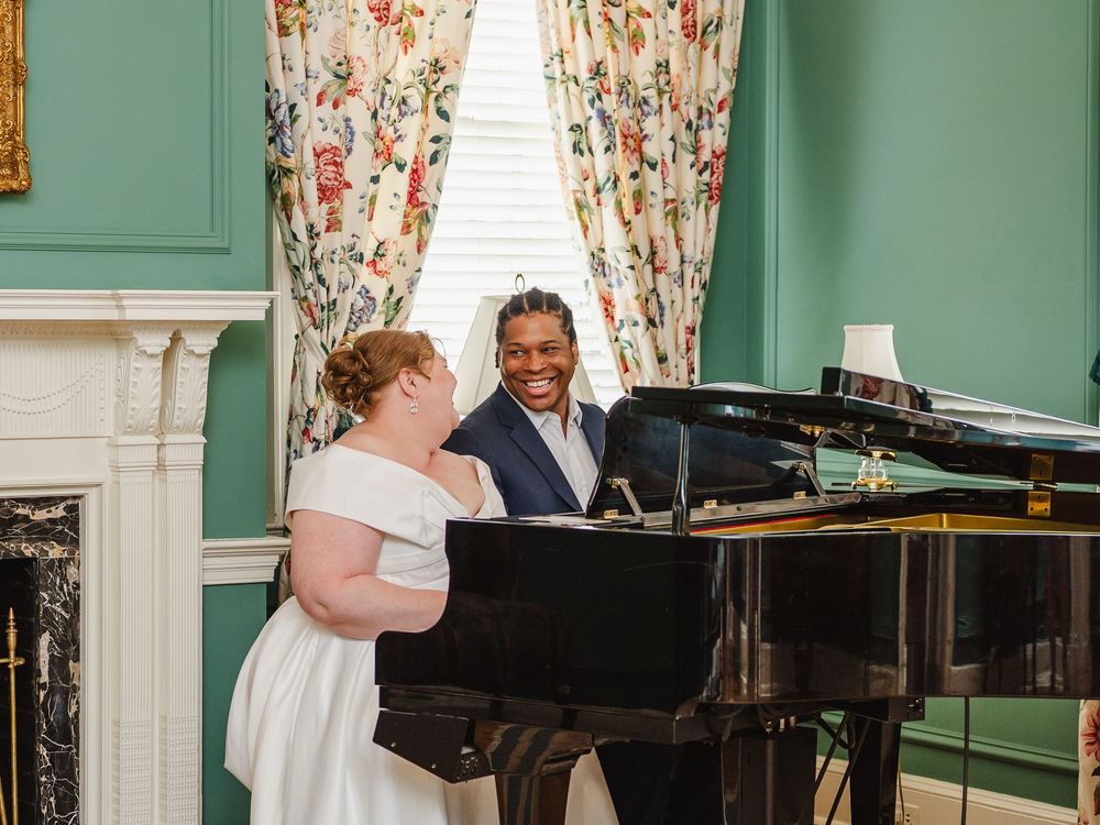 Editorial engagement photo of couple at the grand piano inside Allandale Mansion Kingsport TN
