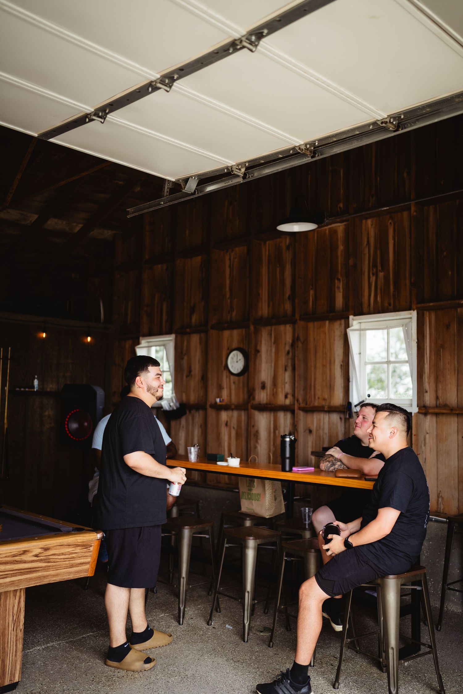 Wedding preparations in a rustic wooden room with people getting ready.