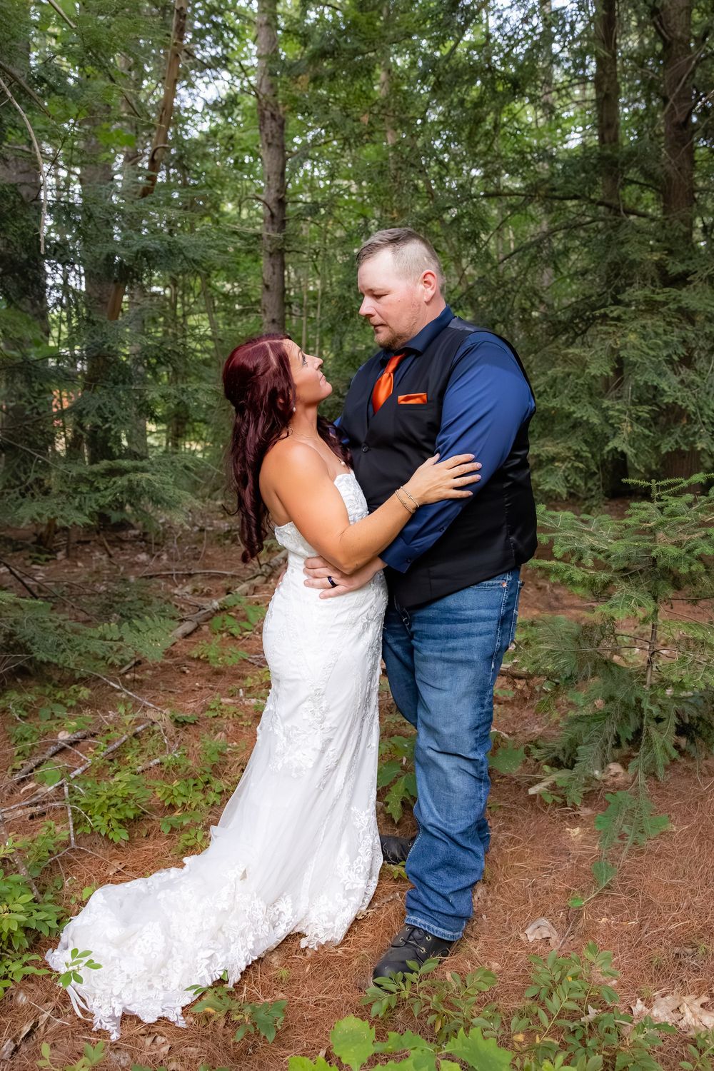 A romantic sequence of wedding photos showing a couple dipping pose in a forest setting.