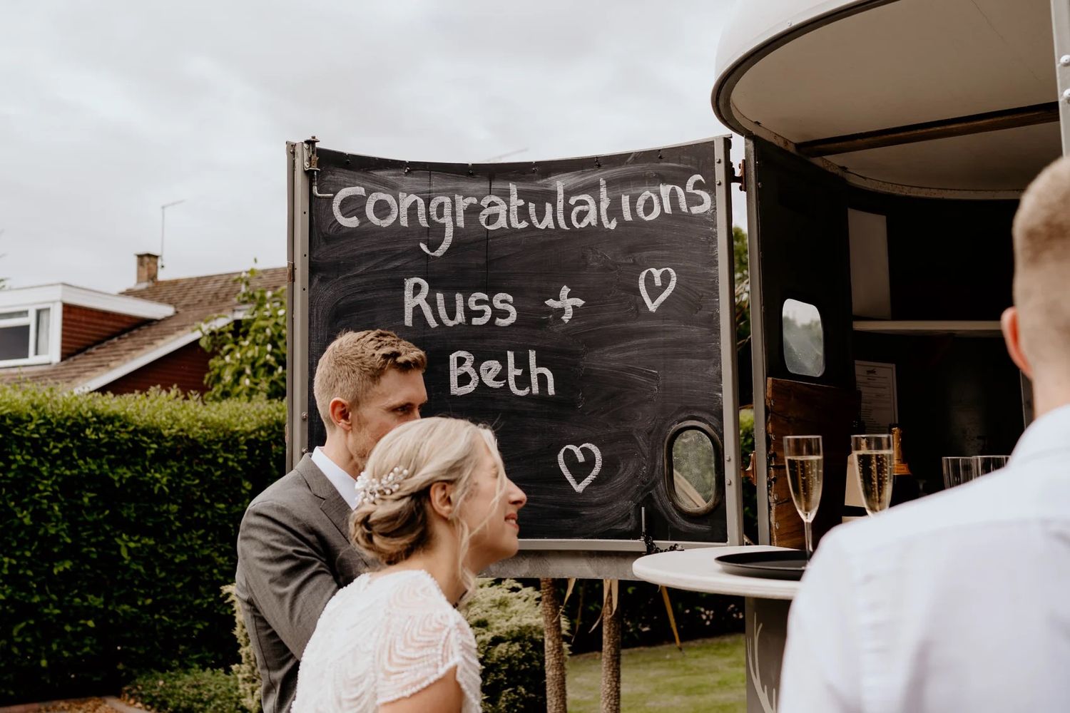 A series of wedding celebration photos showing romantic moments and congratulatory messages on a chalkboard sign.