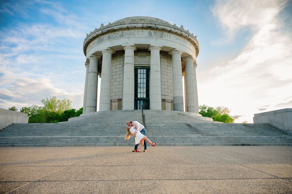 A couple shares a romantic moment on the steps of the George Rogers Clark Memorial during a sunset photoshoot in Vincennes Indiana.