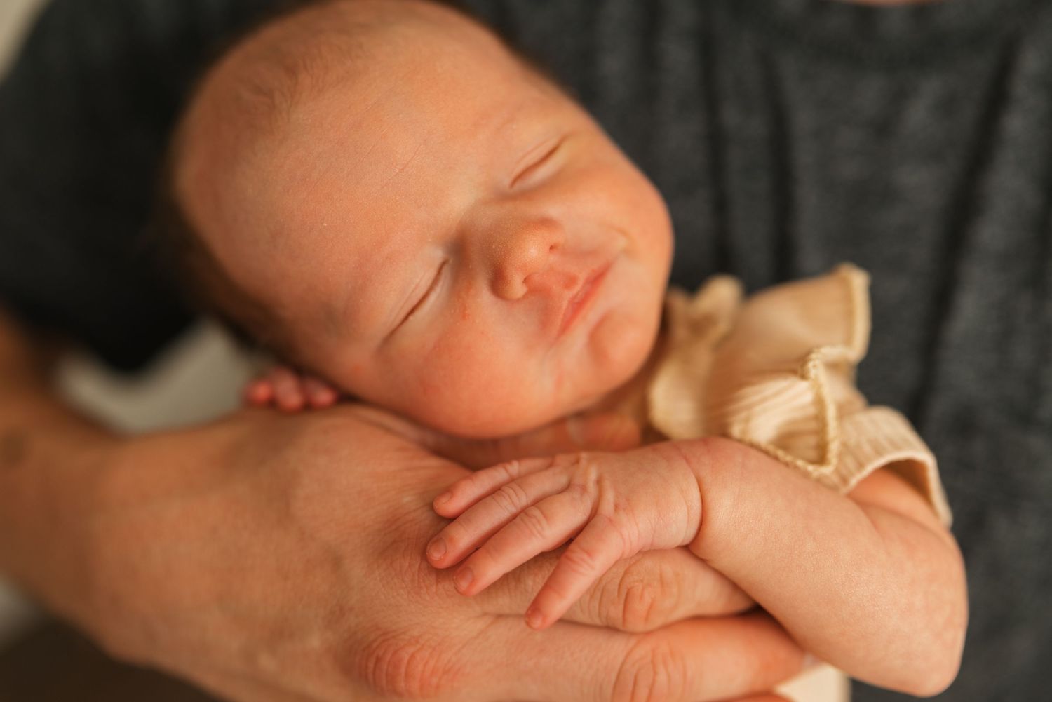 Close-up shots of a newborn baby's tiny features and details.