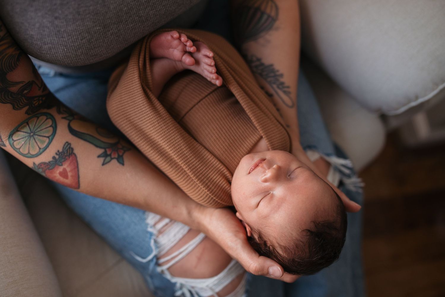 Intimate close-up shots of parents bonding with their newborn.