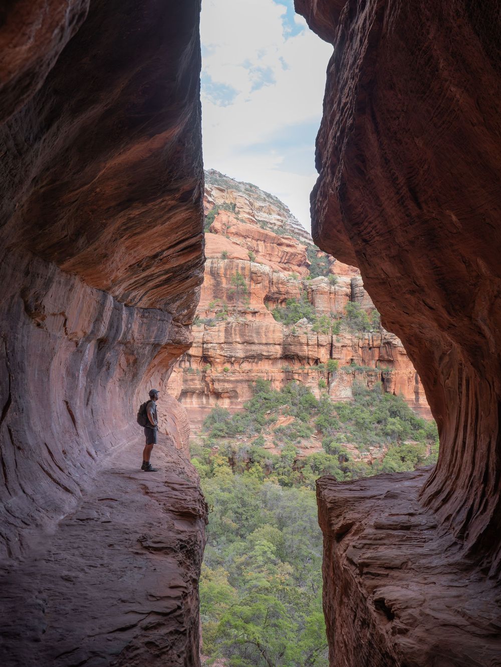 A series of four photos showing red rock canyon walls and natural arches in Sedona against a blue sky.