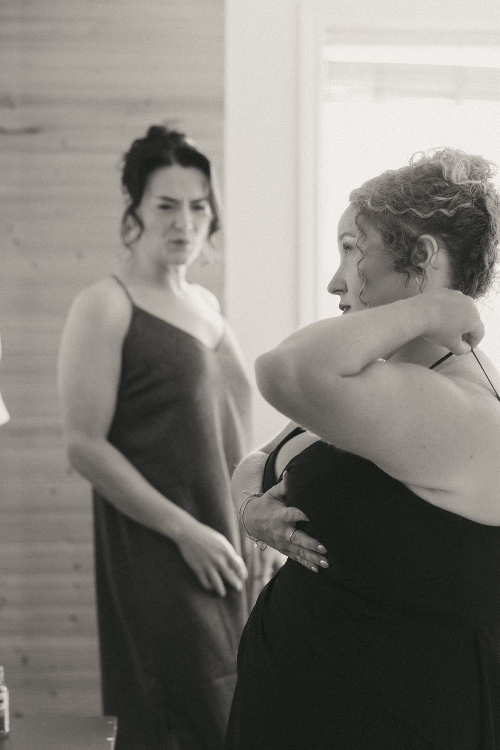 Bride getting ready at a Trinity Airbnb by Newfoundland documentary style wedding photographer Kaitlyn Yvette