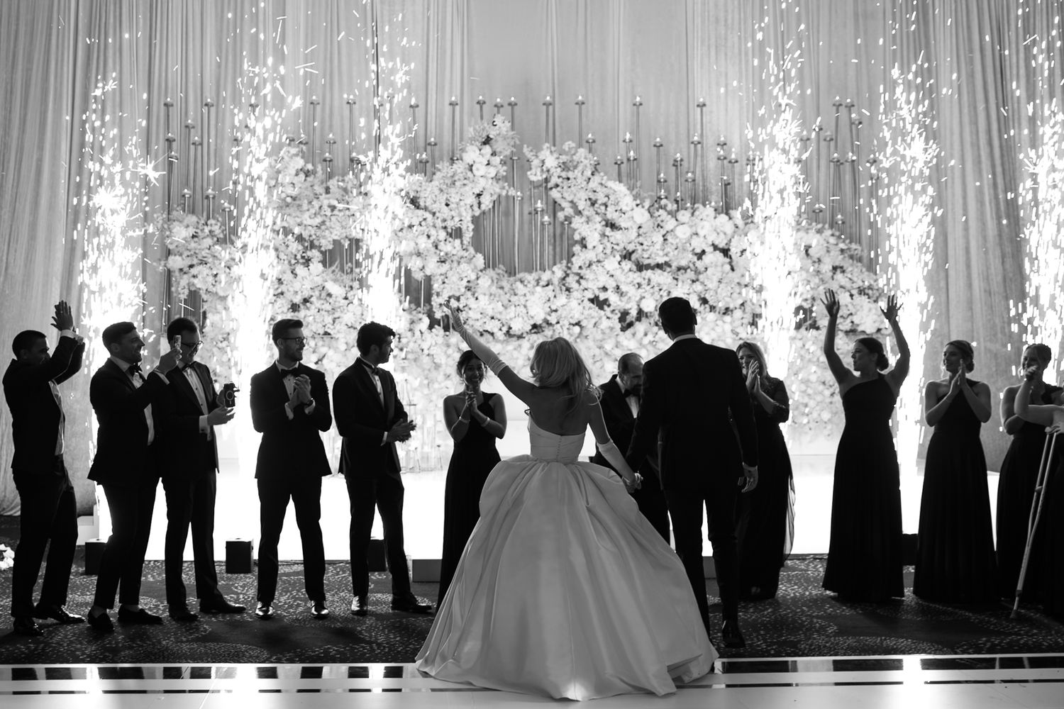 A black and white film sequence showing silhouettes of dancing figures against light backgrounds.