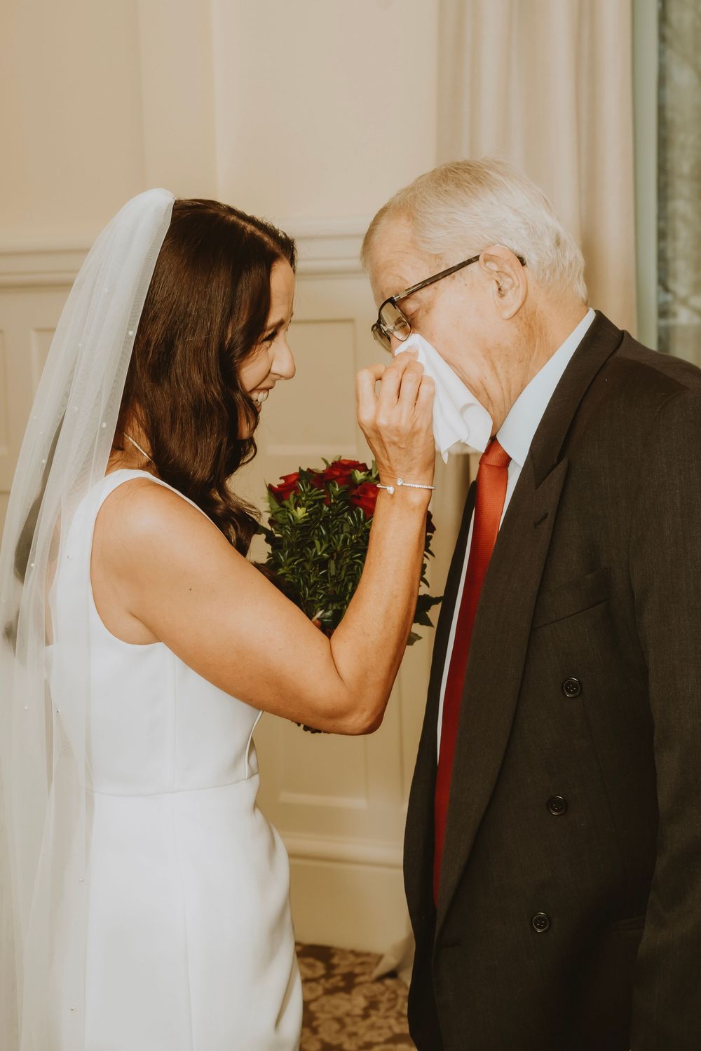 Emotional first look sequence between bride and elderly family member captured in multiple candid frames during wedding.