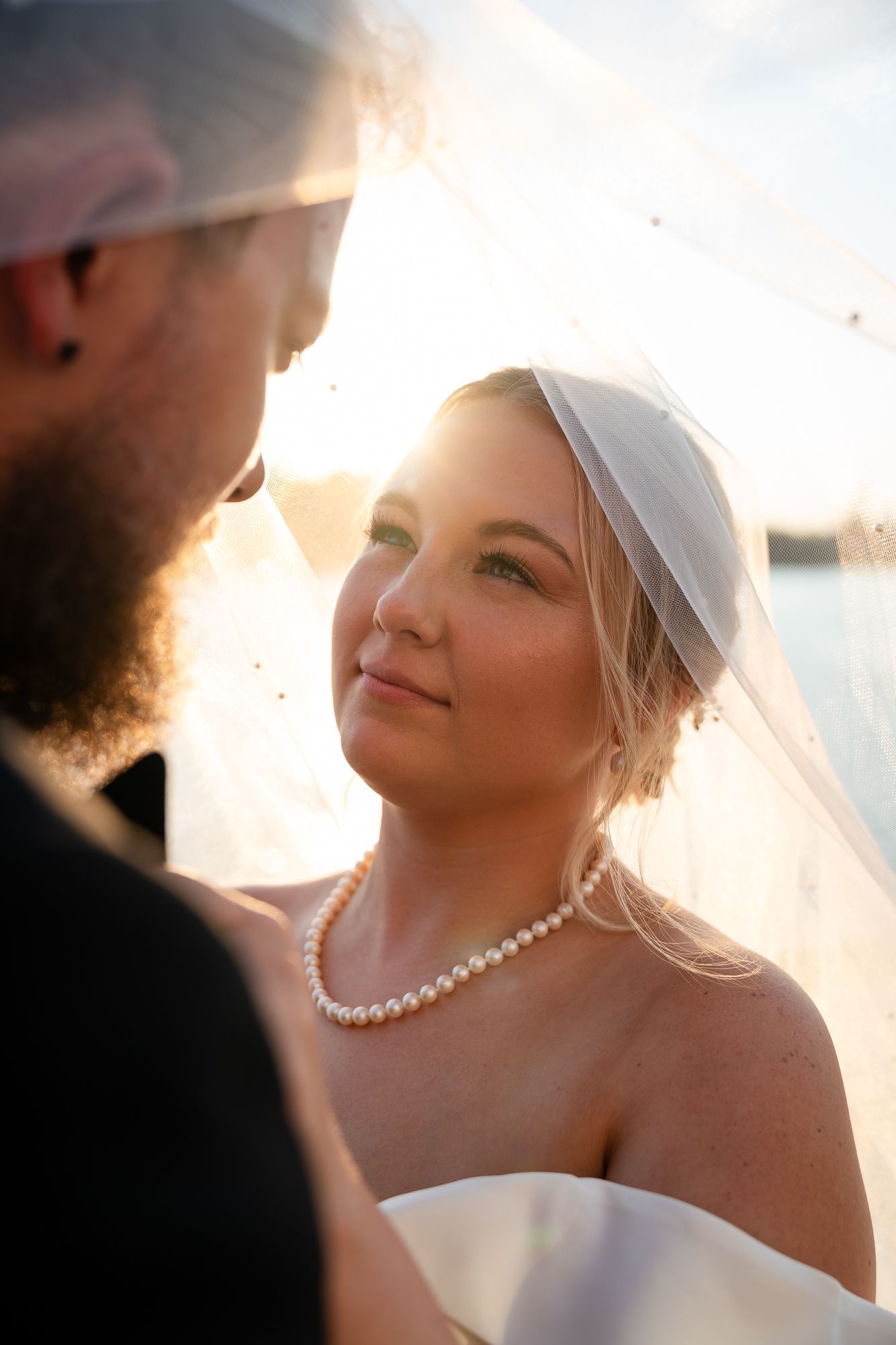 Couple sharing a quiet moment on the Riverwalk during their wedding day in Historic Downtown Wilmington, NC - 128 South Wedding Venue