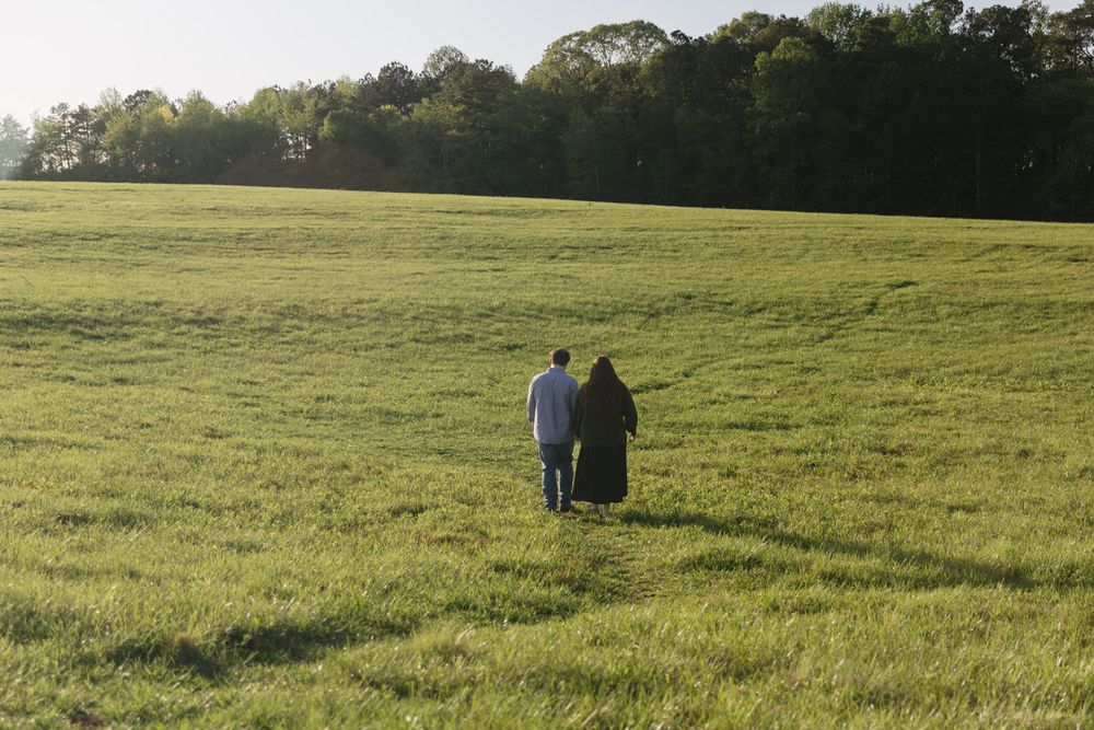 Twirling engagement photos in North Georgia sunset