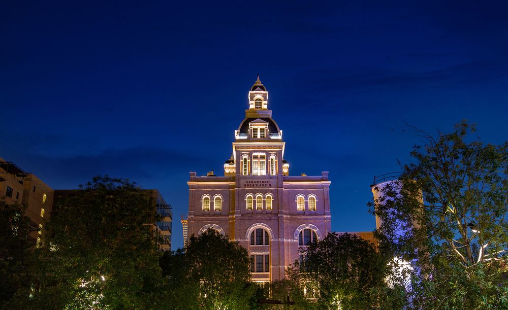 Historic courthouse building illuminated at night with classic architecture.