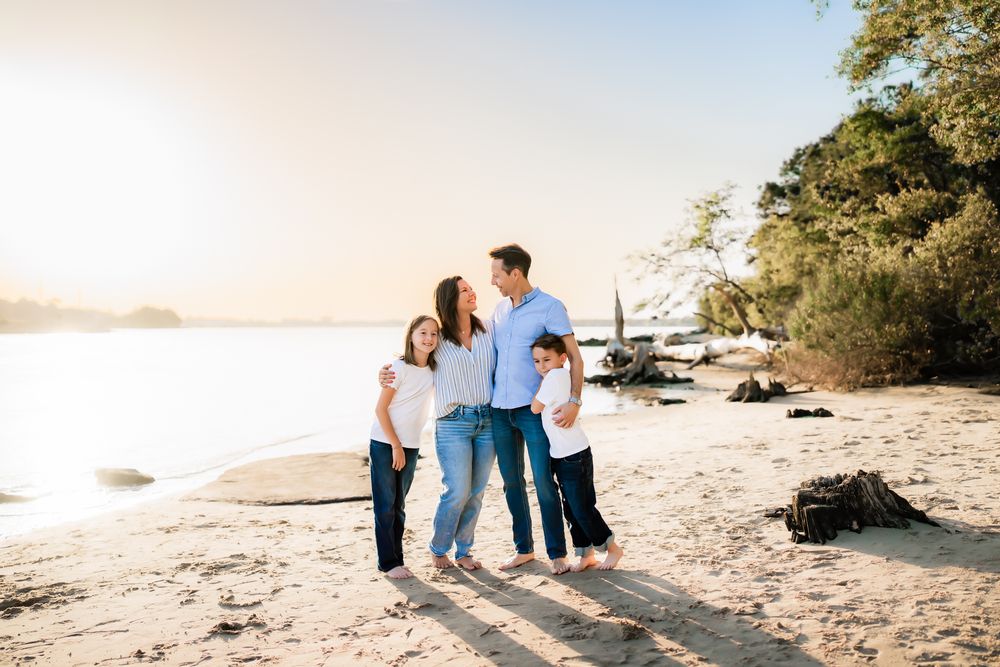 Beautiful series of coastal beach photographs showing family moments at sunset on a sandy shore.