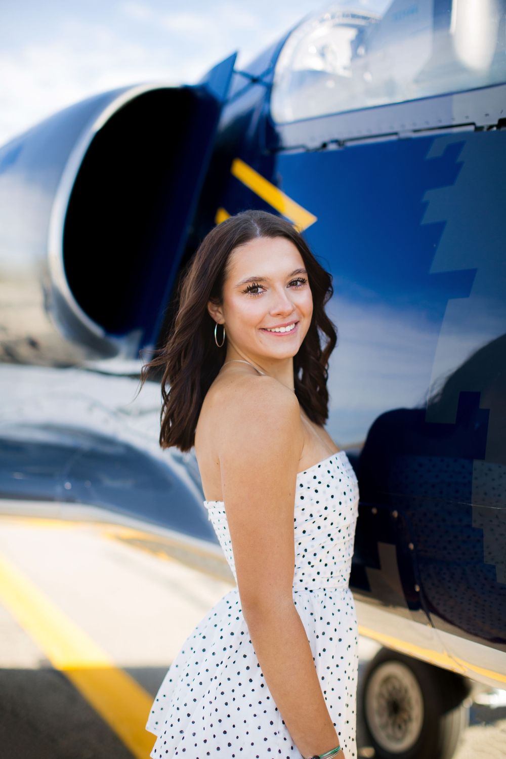 High school senior photo of girl; aviation senior portrait session in Howell, Michigan by Brighton, MI photographer