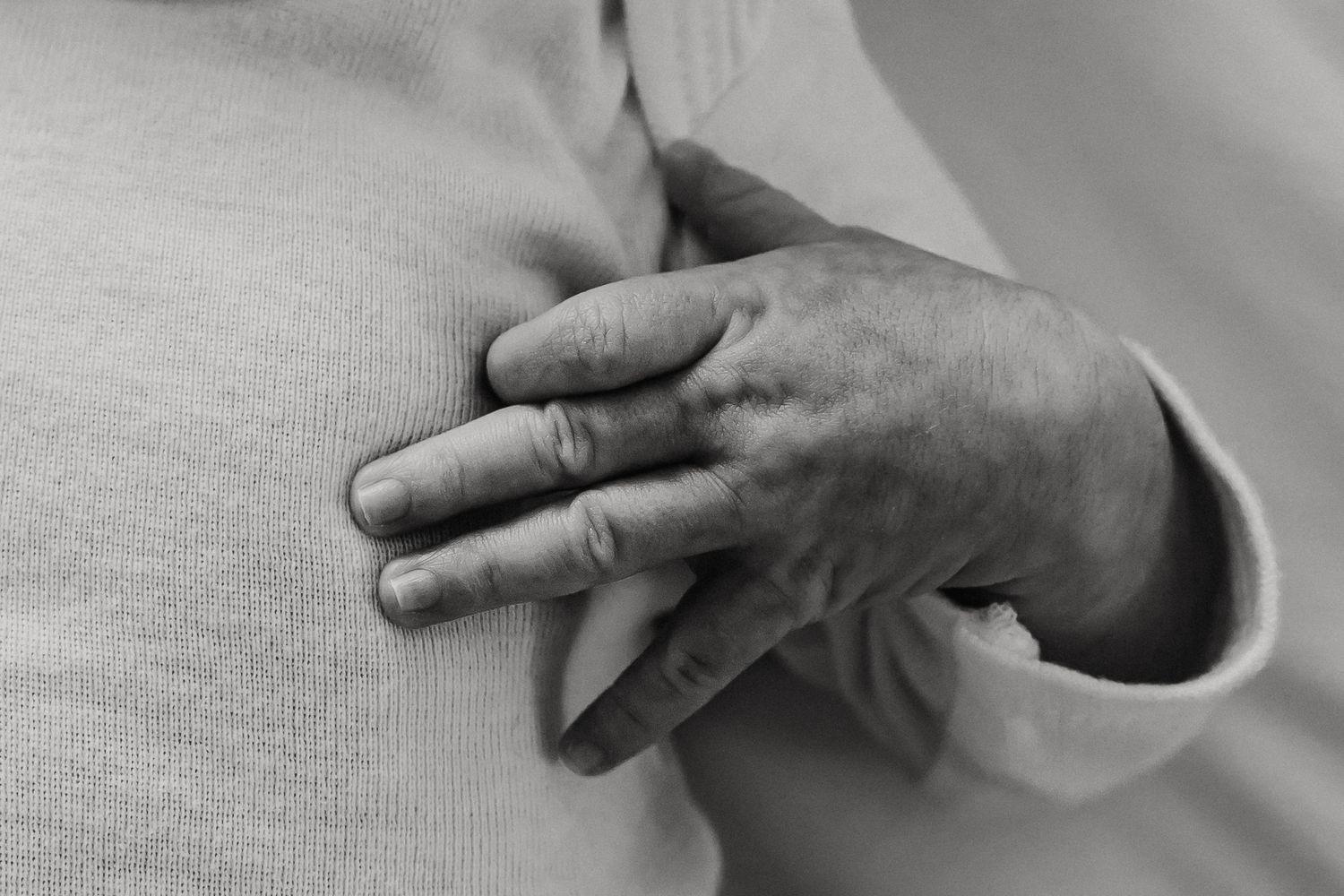 An Oahu Newborn photographer captures a newborn baby's tiny hands during an Oahu Newborn photo session.