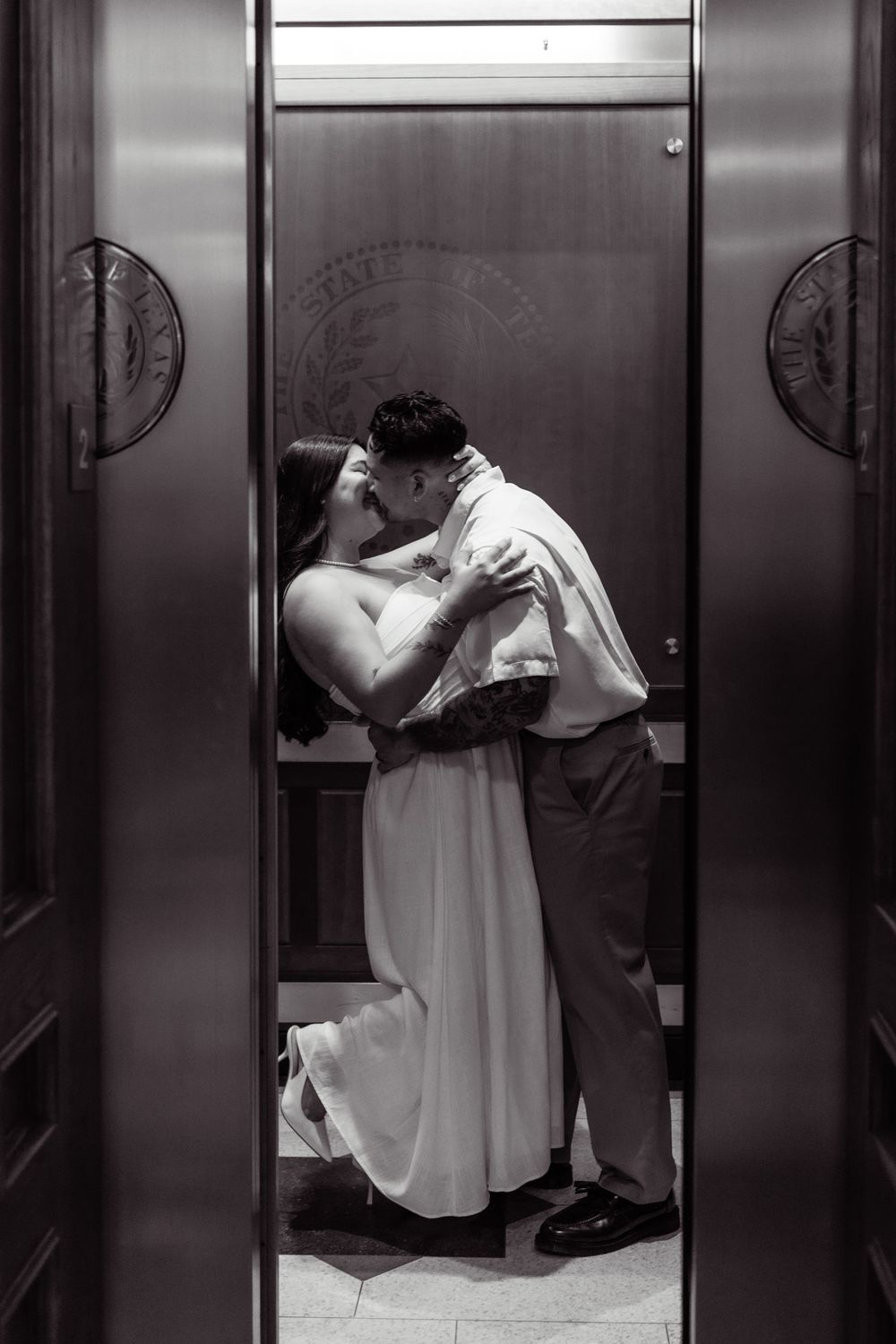 Artistic sequence of a couple dancing in front of mirrored elevator doors during a wedding celebration.