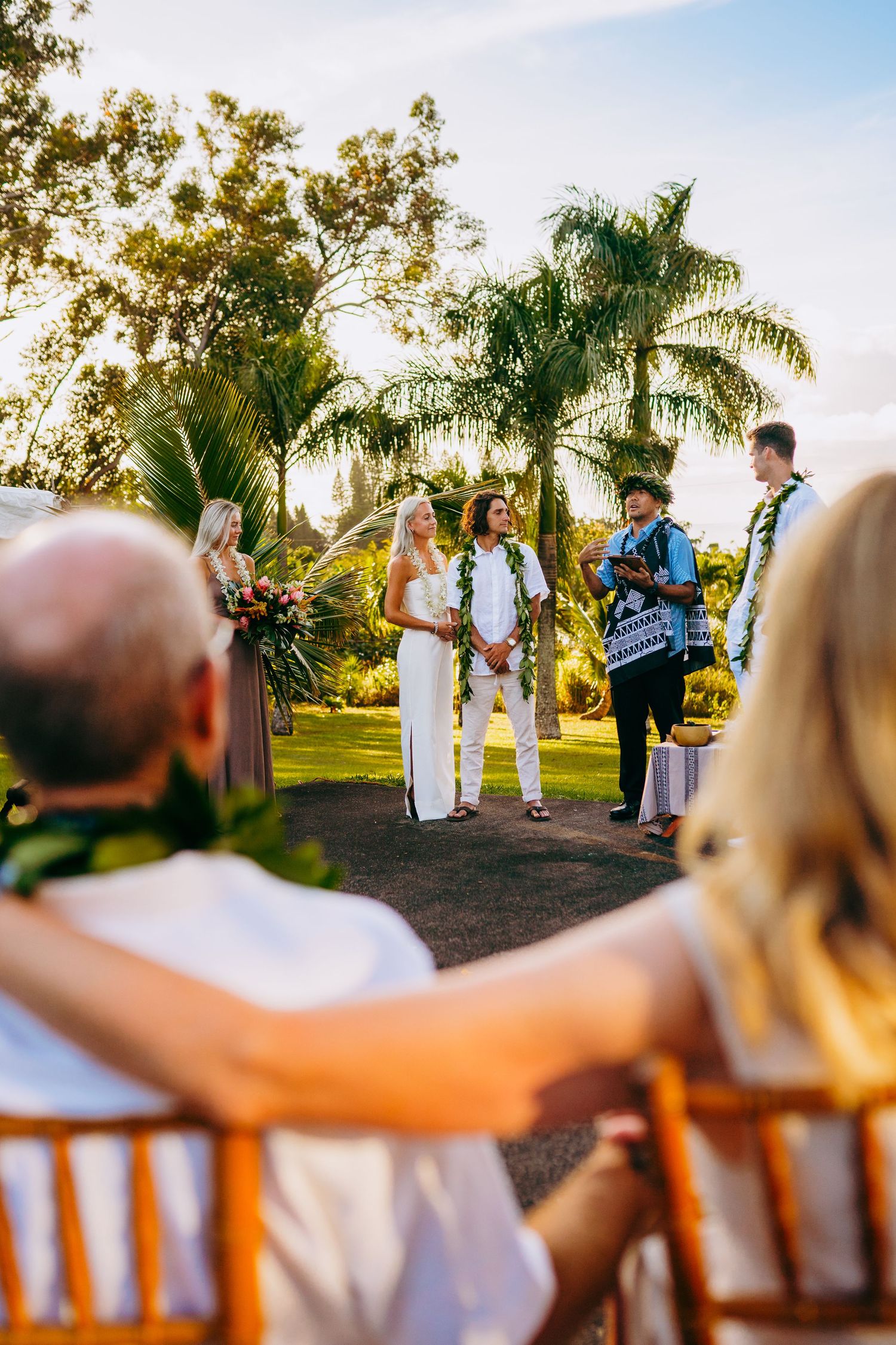 Parents of the bride look on at the wedding ceremony for a maui haiku wedding.