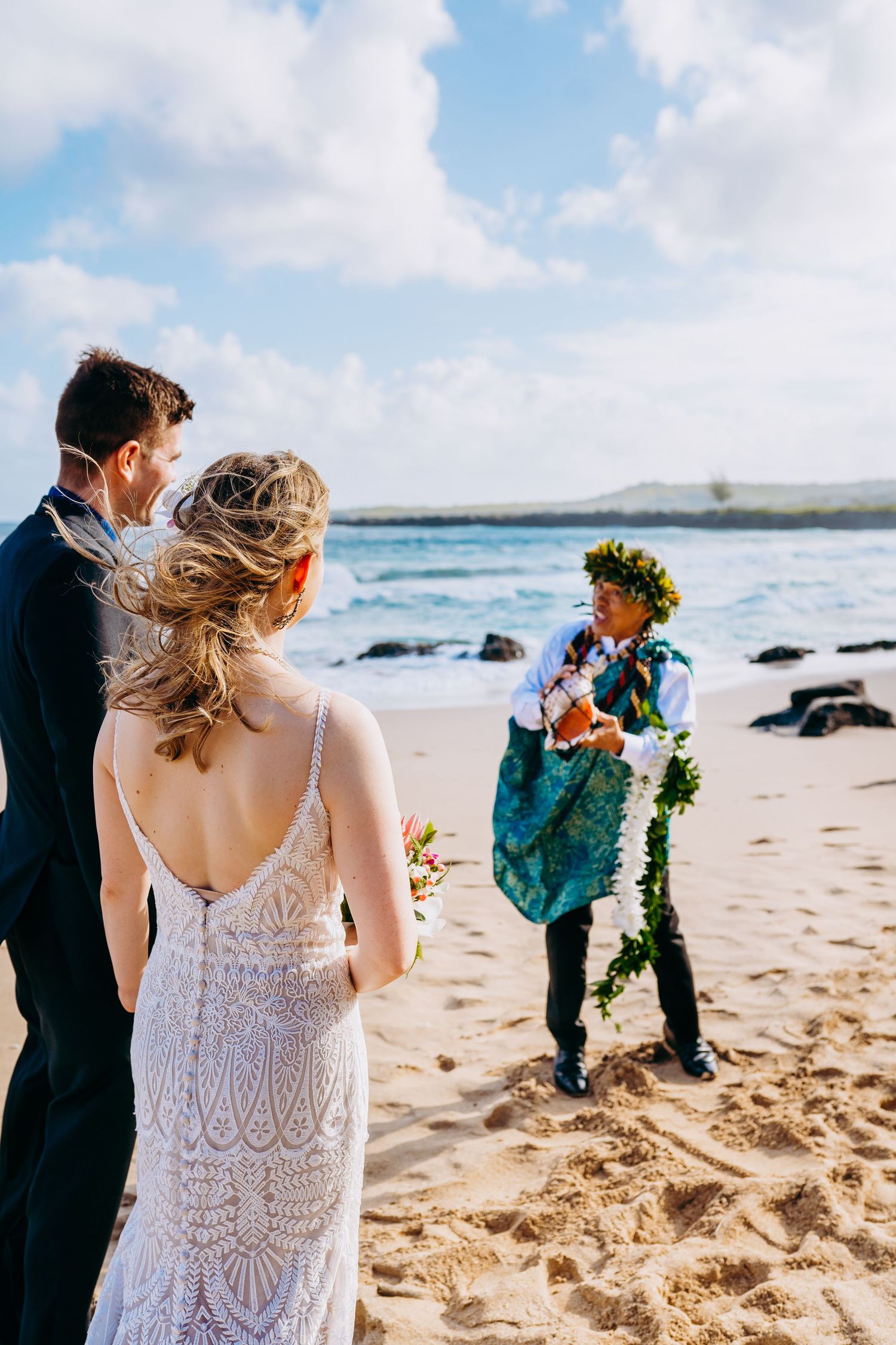 Wedding ceremony on sandy beach with traditional Hawaiian elements and ocean views.  Maui Hawaii wailea kihei makena beach wedding ceremony
