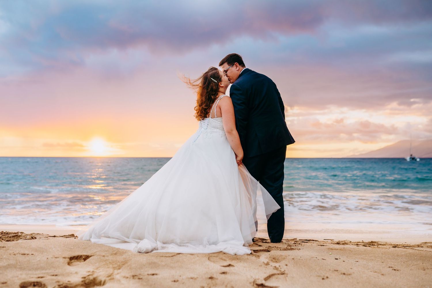 Intimate beach wedding for plus size bide captured in a close-up shot at golden hour. Maui Hawaii wailea kihei makena beach wedding ceremony