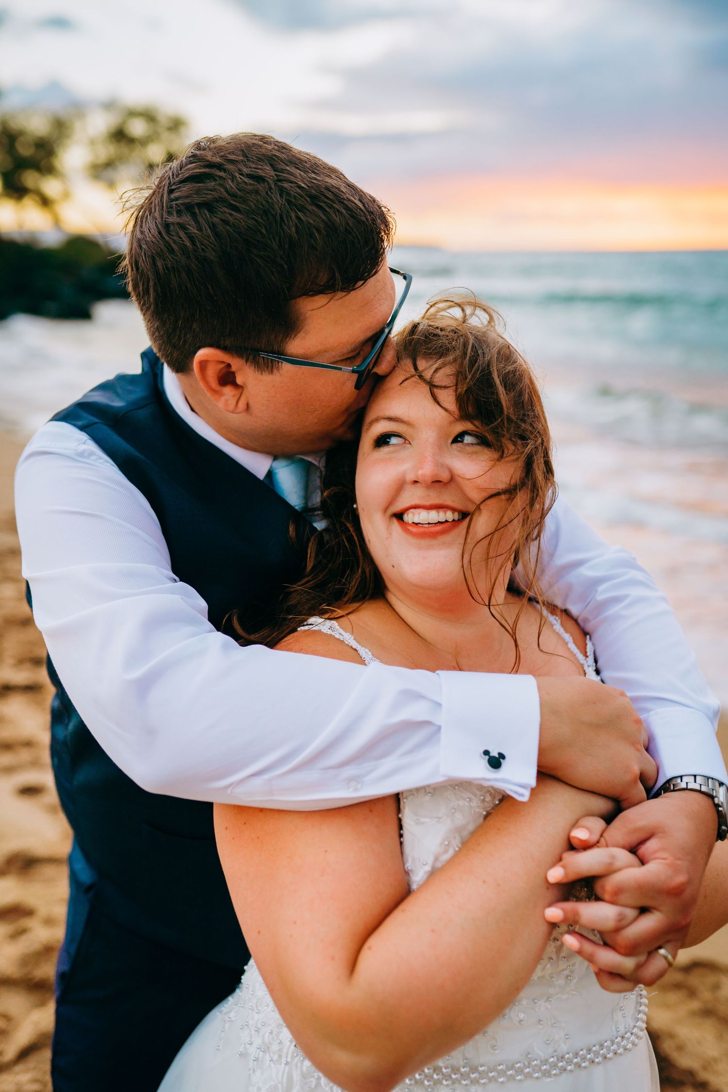 Intimate beach wedding for plus size bide captured in a close-up shot at golden hour. Maui Hawaii wailea kihei makena beach wedding ceremony