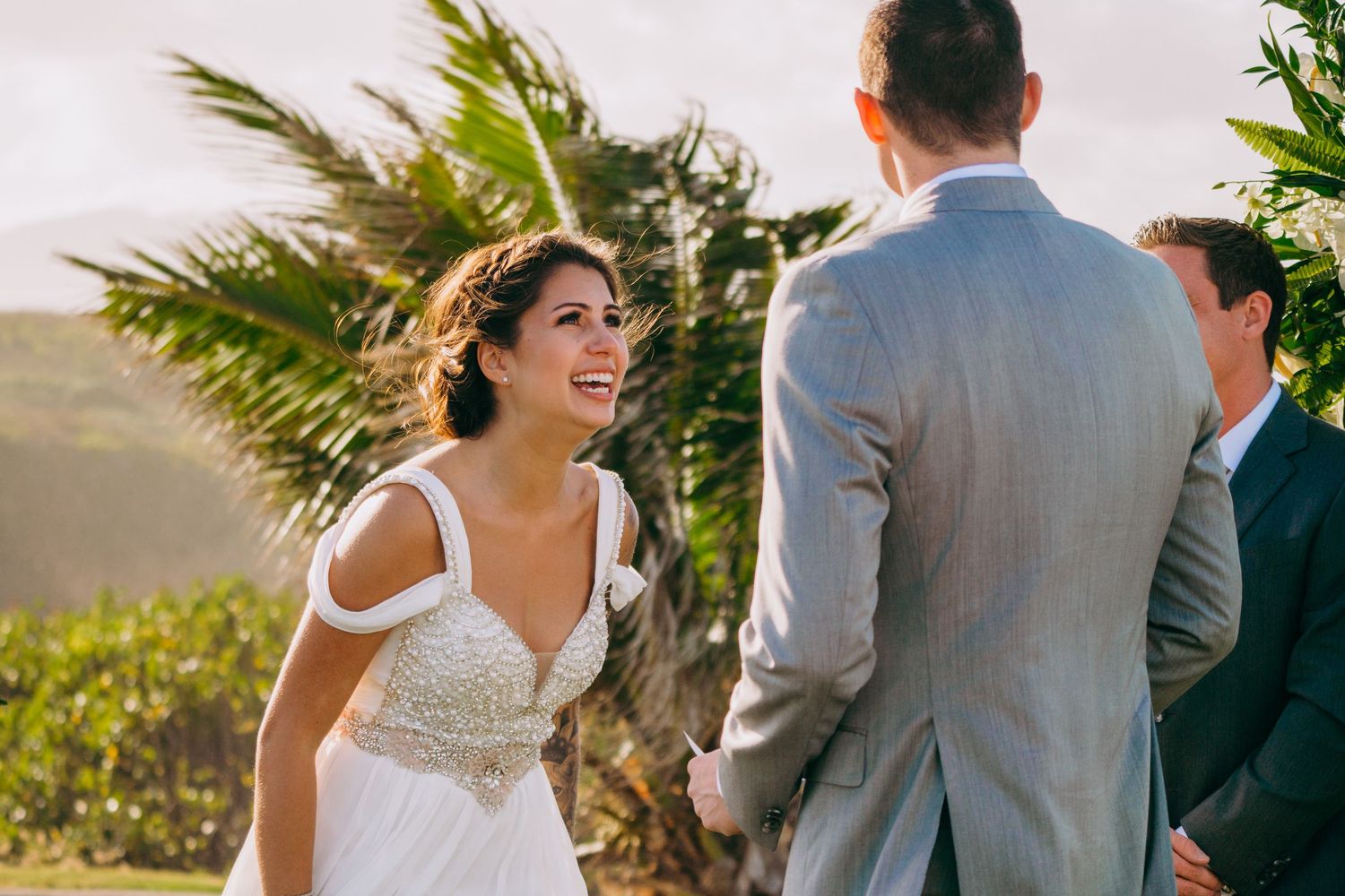 Wedding ceremony setup with tropical greenery and natural lighting. Maui Hawaii Oahu Kaneohe Bay wedding military wedding bride and groom