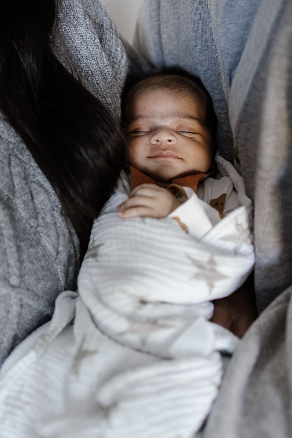 Baby smiles while sleeping at in-home photography session with Cindy Tucey Photography in San Jose