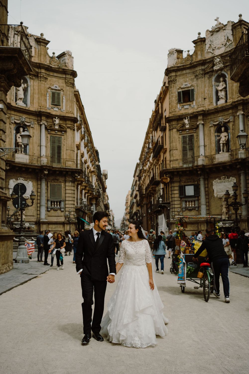 Beautiful couple in the streets of Palermo during their wedding in Sicily