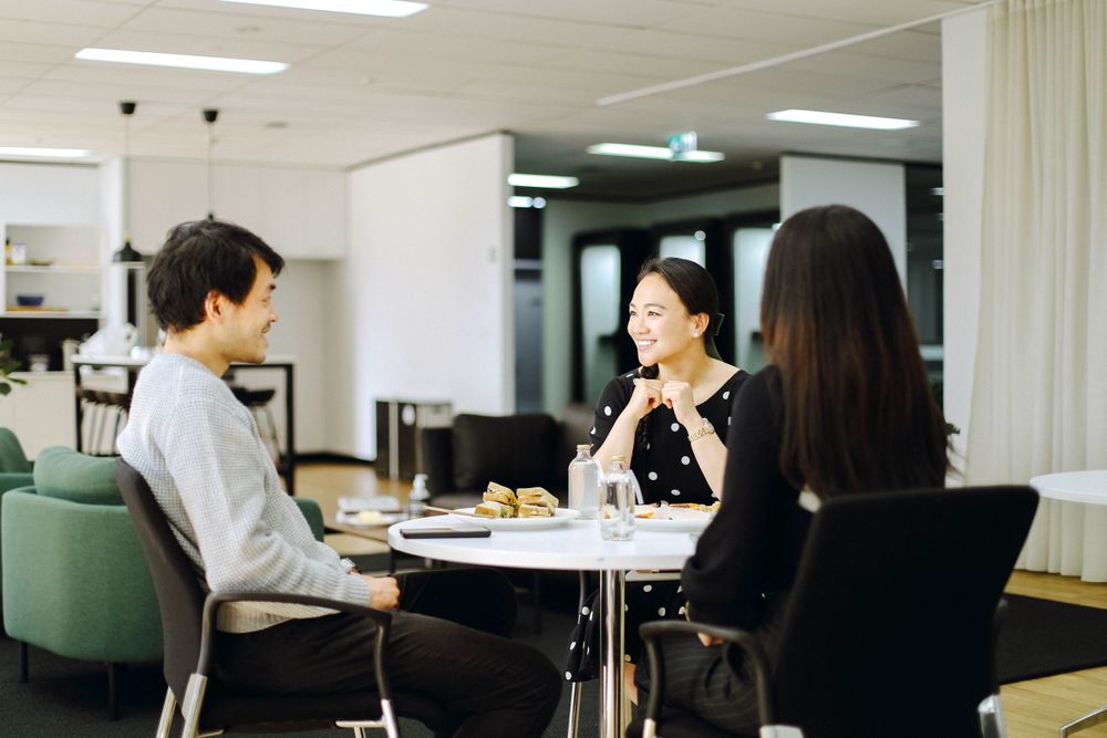 Small group having an informal business meeting at a round table.