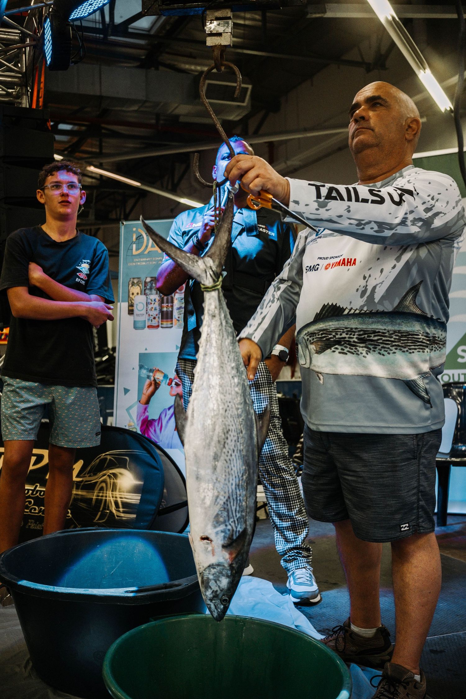 Large fish being weighed at fishing competition or market.