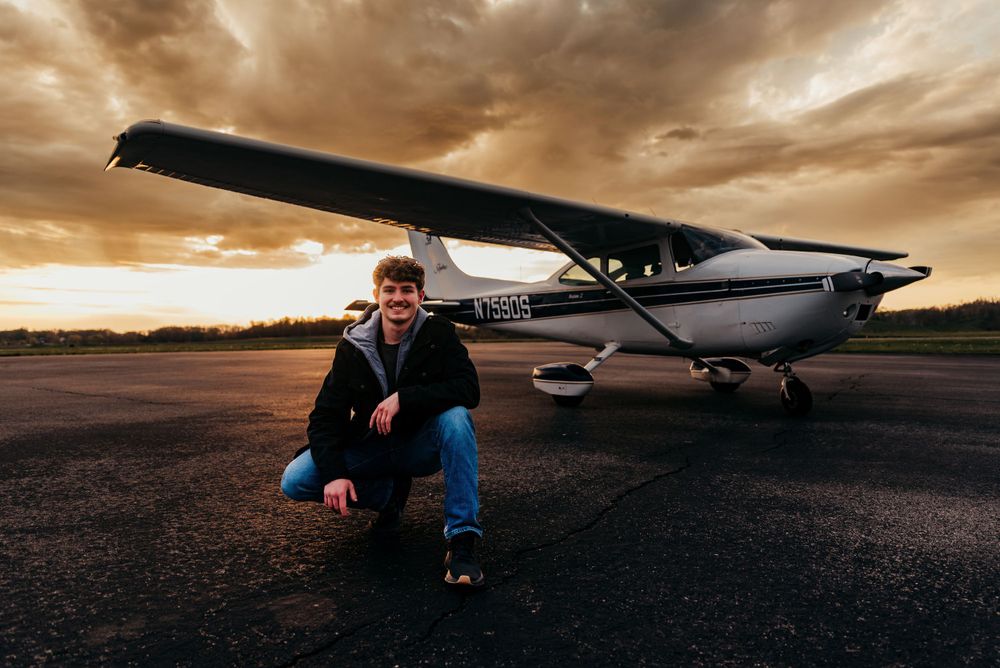 Man in front of plane