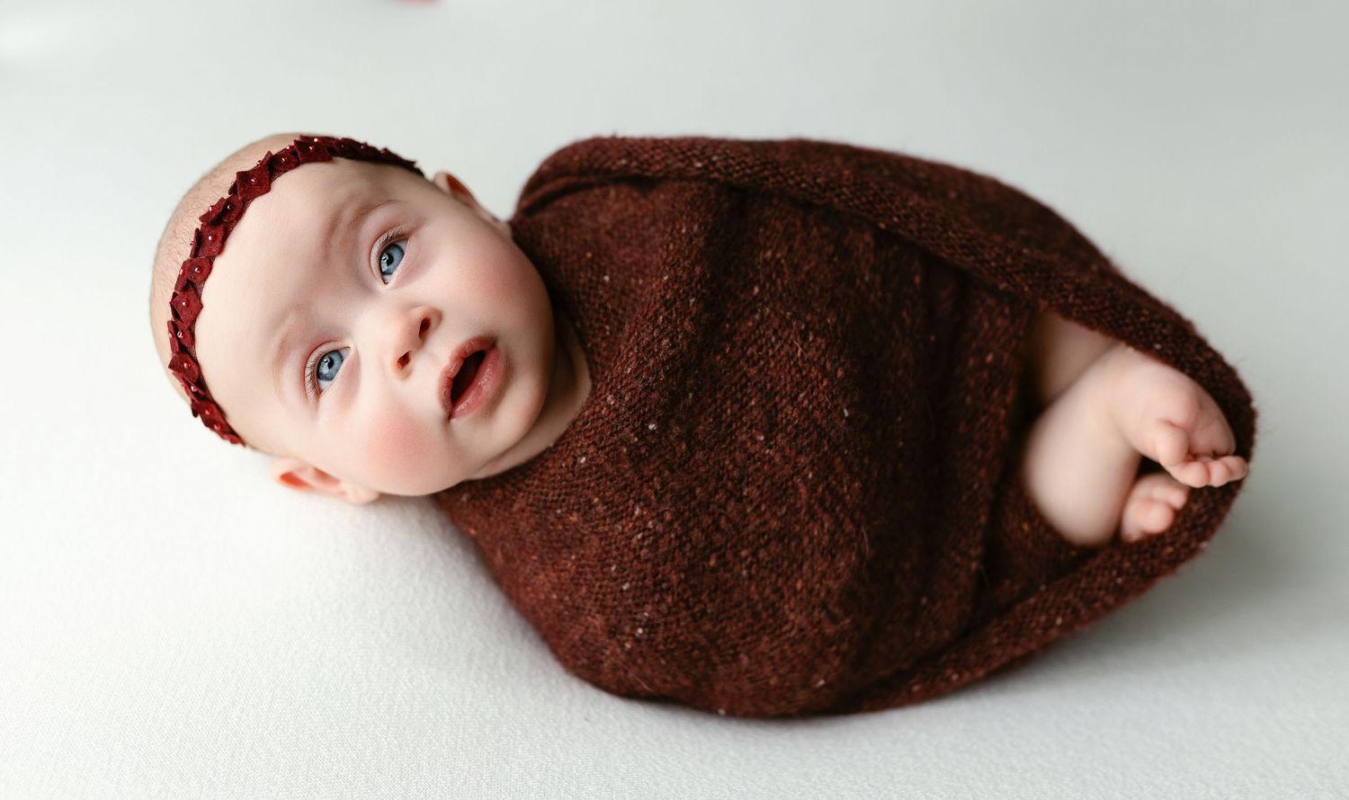 A baby girl in a red wrap. Greenville, SC newborn photographer, Easley SC newborn photographer, Upstate newborn photographer